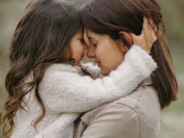 child and mother embracing